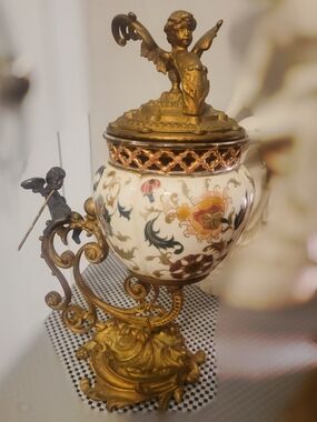 Porcelain vase with bronze mounts and cherub finial, late 19th century